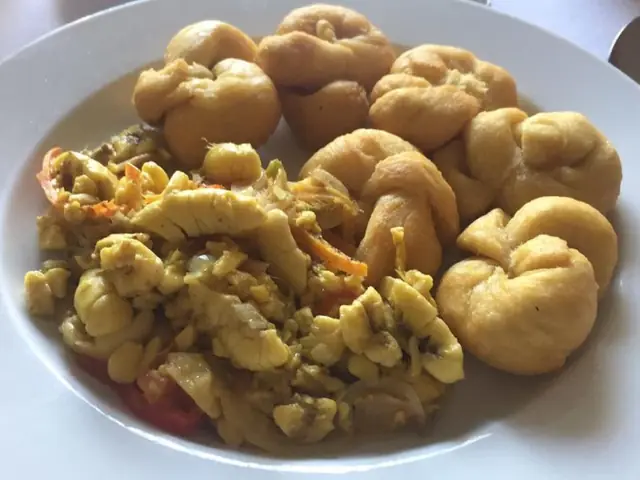 Jamaican breakfast: ackee and saltfish with dumplings